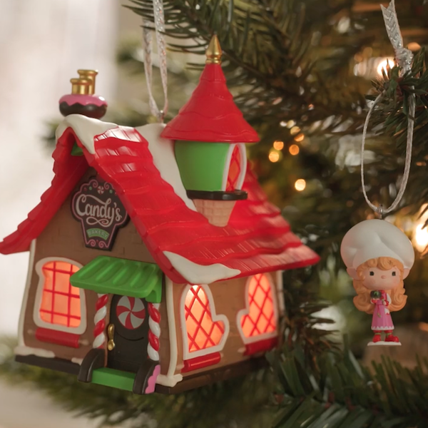 The first in a new Keepsake Ornament series called Welcome to Elfville, the Candy's Bakery ornament looks like a decorated gingerbread house and comes with a second ornament...a tiny elf in a baker hat, ready to offer you a sweet treat.